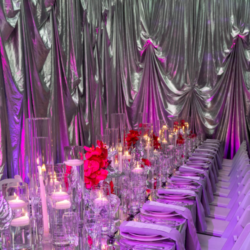 silver disco party with red lighting reflections