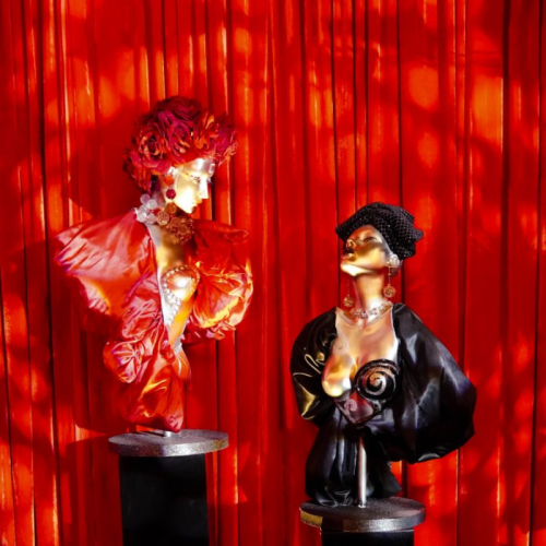 red velvet back drop with manequins