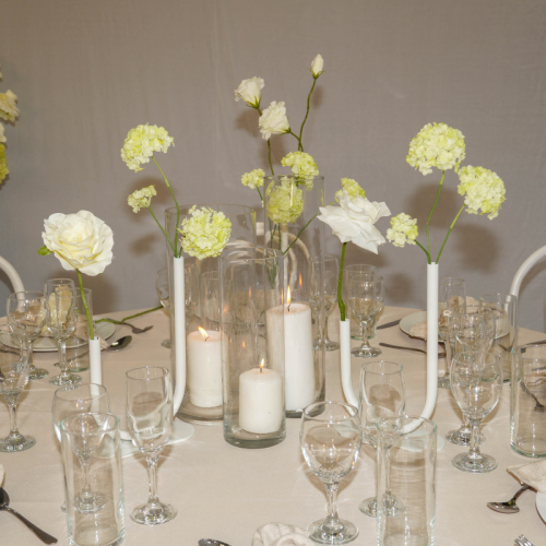 small white florals in curved vases
