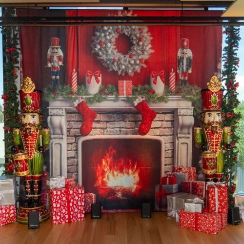 Christmas fireplace backdrop with nutcracker props and presents