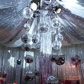 silver draped tented roof with mirror ball centrepiece