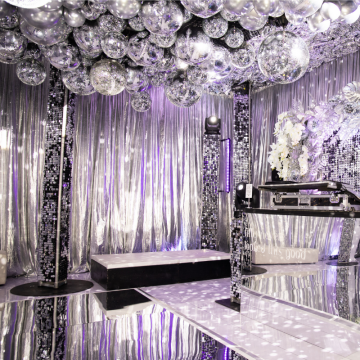 silver balloons and disco ball dancefloor roof