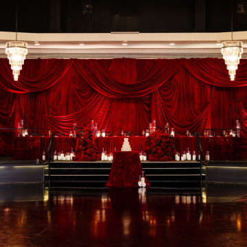 chiffon draped backdrop behind bar
