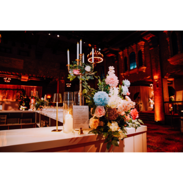 Bloom & Bliss Floral Bar Feature with pastel artificial florals, roses, hydrangeas, greenery and candle styling on a wedding bar display.