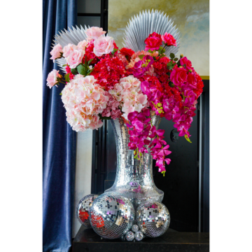 Fuchsia Fever Floral Feature with vibrant pink artificial flowers, orchids and hydrangeas in a silver mirror ball vase for wedding and event styling.