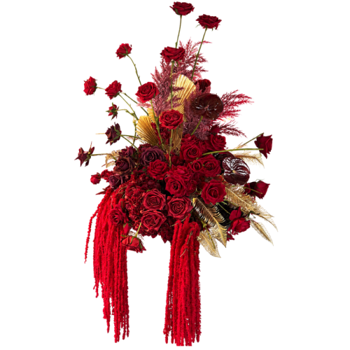 Ruby Royale Floral Feature with deep red artificial roses, gold foliage and cascading faux florals, perfect for luxury wedding and event styling.
