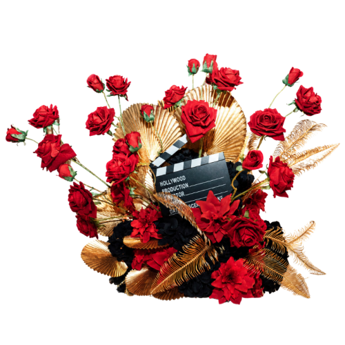 Hollywood Glam Floral Feature with red artificial roses, gold foliage, black florals and movie-inspired styling for luxury wedding and event décor.