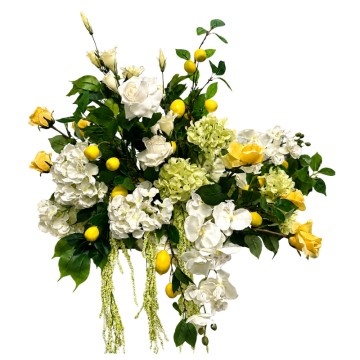 Amalfi Lemon Floral Feature with white artificial flowers, lemons, lush greenery and faux florals for Mediterranean wedding and event styling.