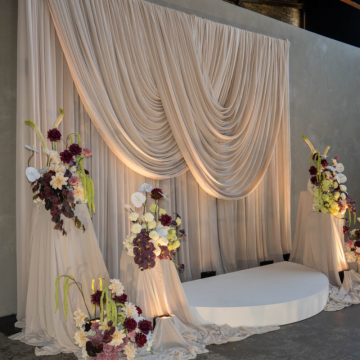 beige drape wedding ceremony backdrop